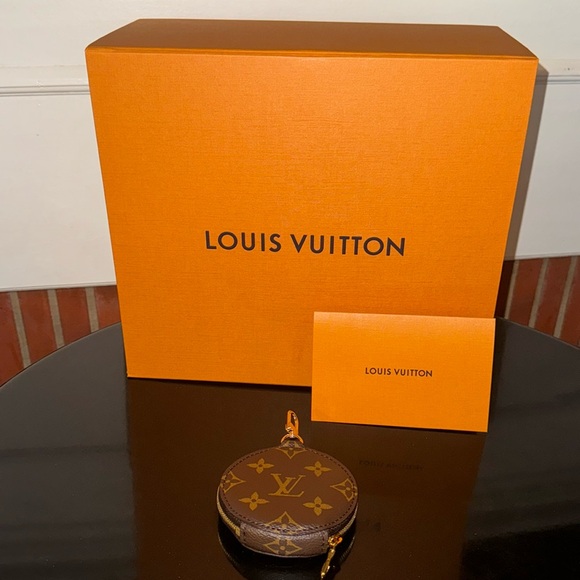 LOUIS VUITTON MINI MNG PIVOINE - Picture 1 of 8